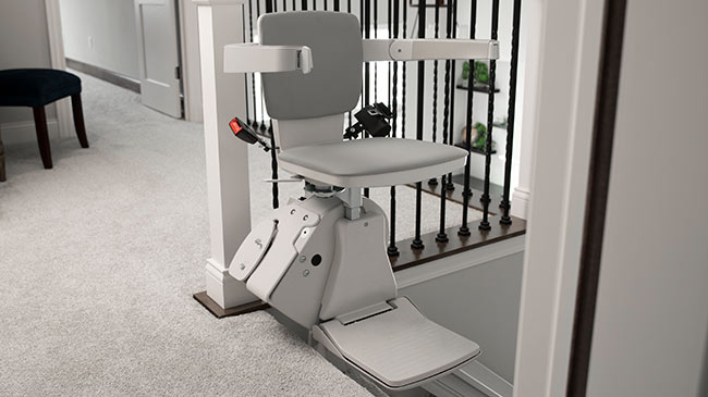Bruno Elan stairlift at the top of a staircase