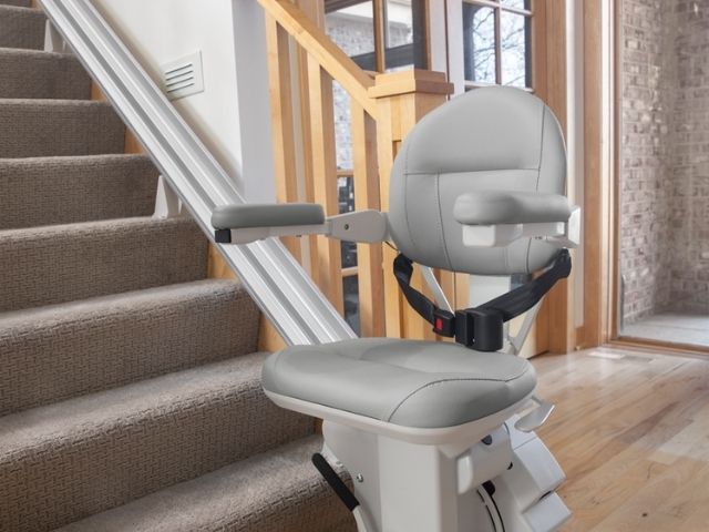 Bruno Elite straight stair lift parked at bottom of steps