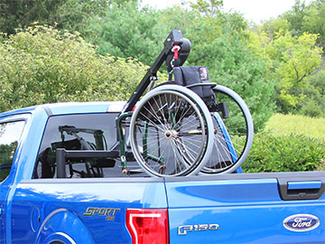 Bruno Out-Rider with mobility device in pickup truck bed