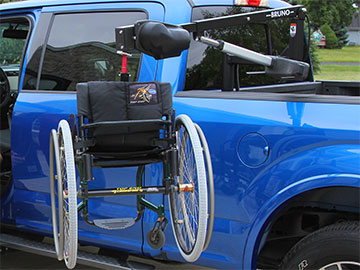Mobility device on the side of a truck using the Bruno Out-Rider