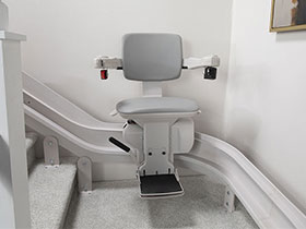 Bruno Elite curved stairlift parked halfway up the steps