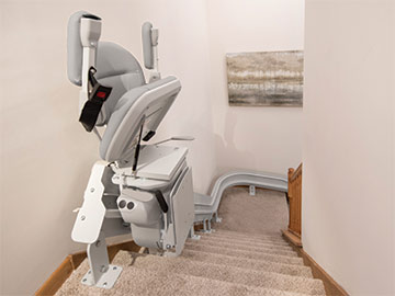 Bruno Elite curved stairlift at the top of the steps
