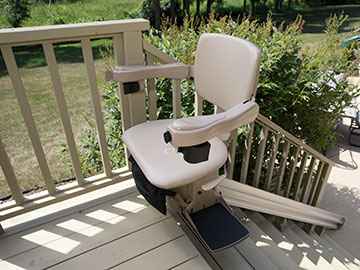 Bruno Elite outdoor stairlift at the top of a deck