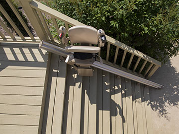 Bruno Elite straight outdoor stairlift folded up mid-rail