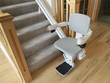 Bruno Elite Straight Stairlift at the bottom of a staircase