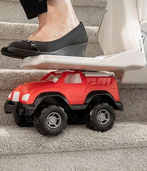 a person's feet on a toy truck