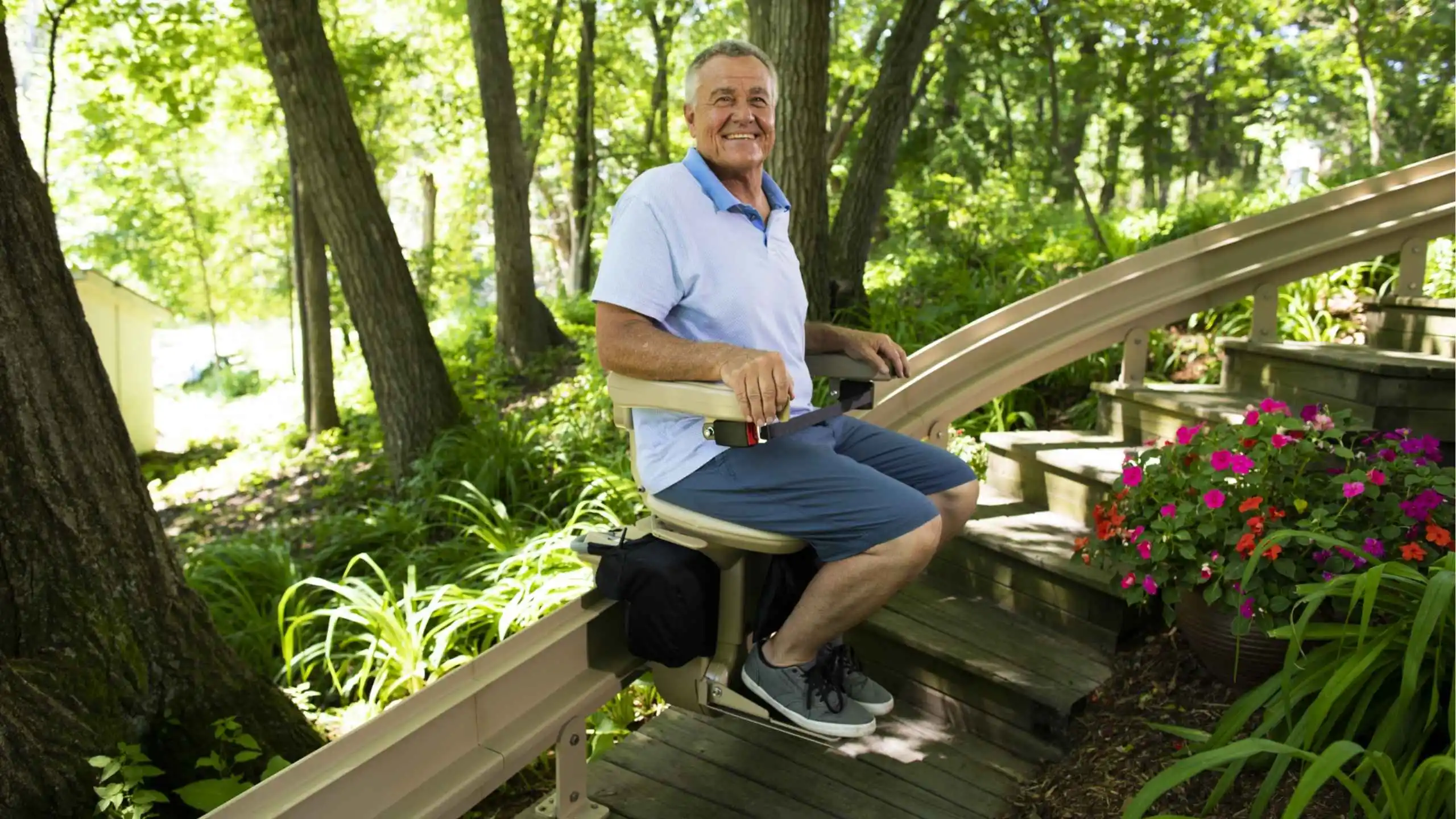 a man sitting on a bench in a park