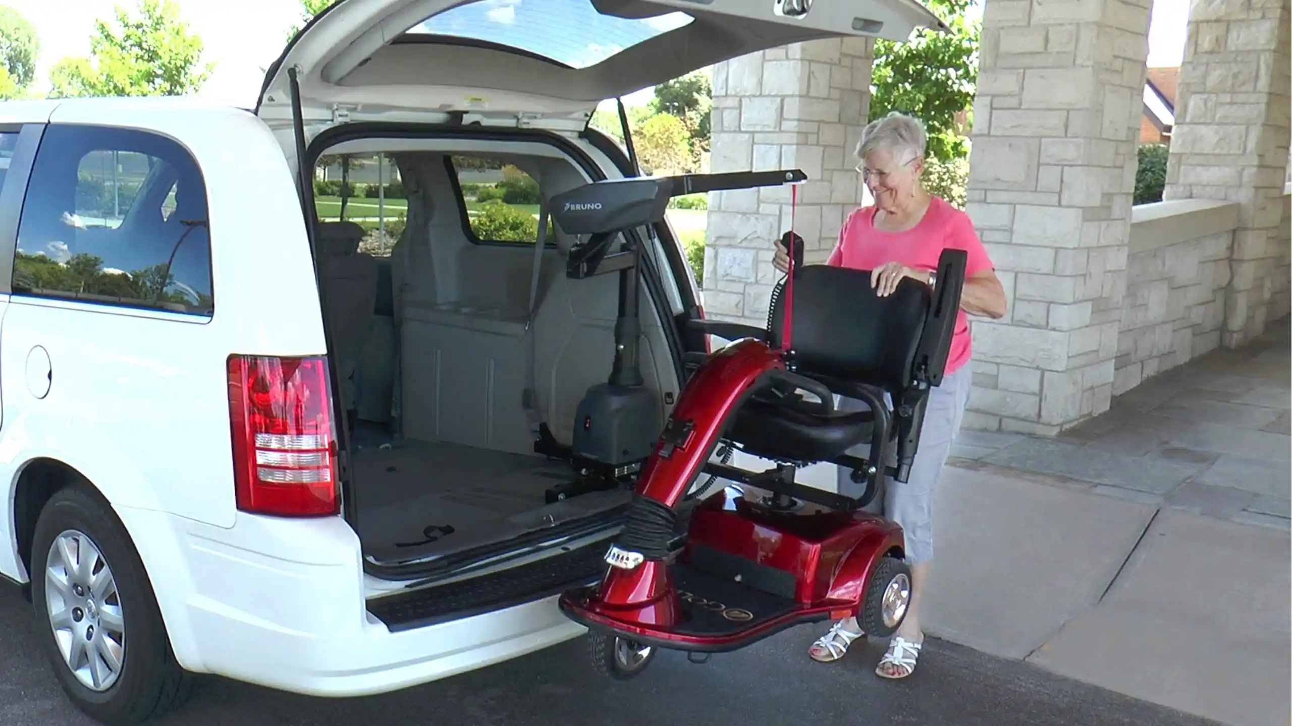 a woman standing next to a wheelchair