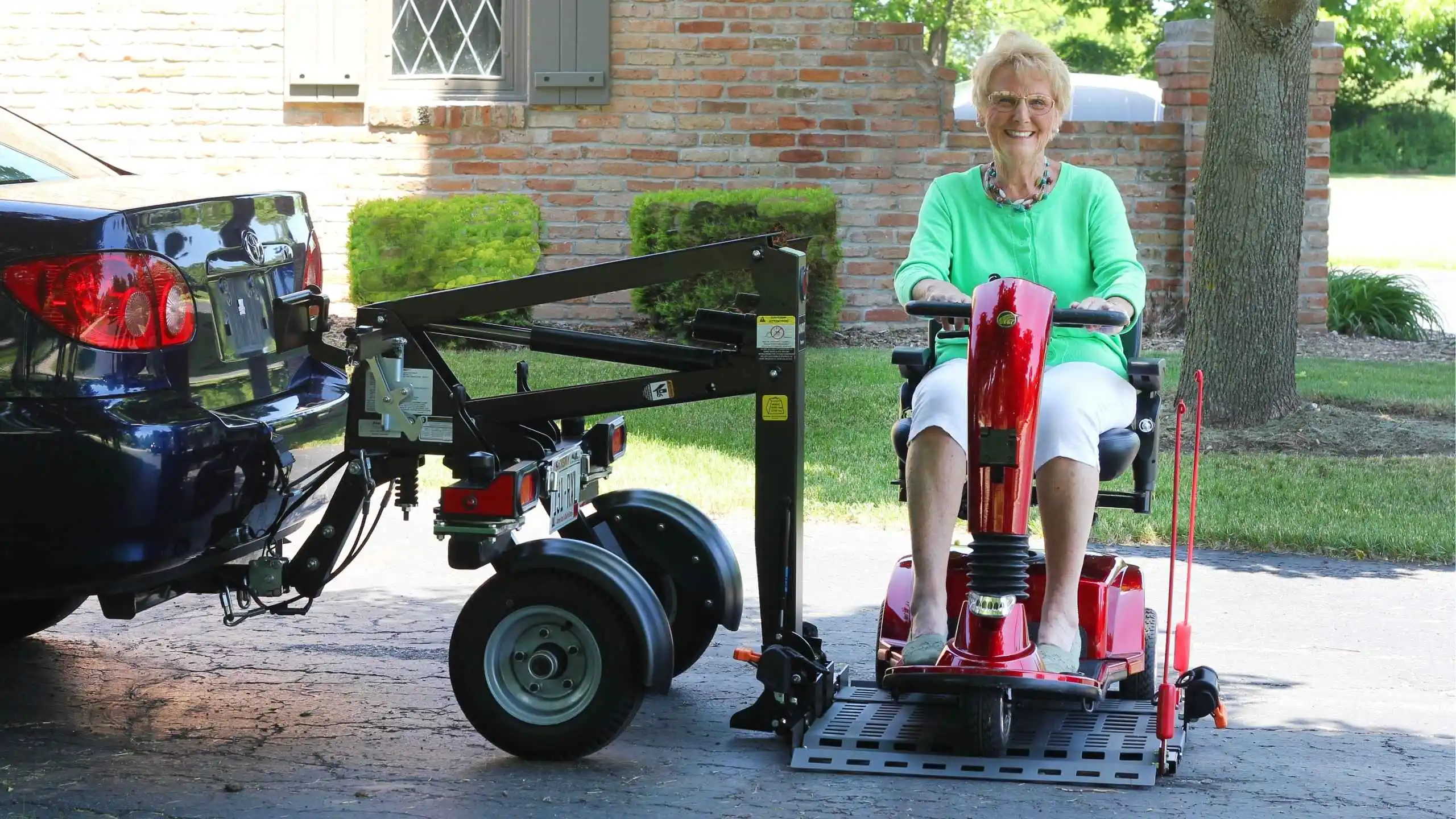 a woman sitting on a red scooter