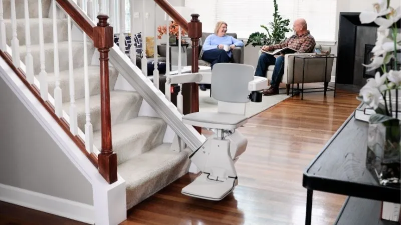 a man and woman sitting on stairs