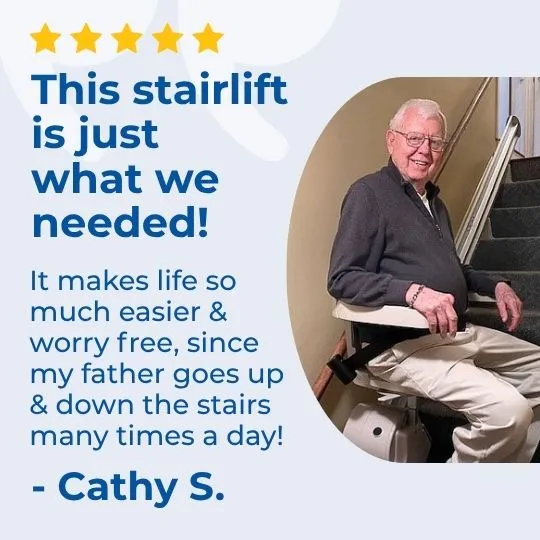 an older man sitting on a stair lift
